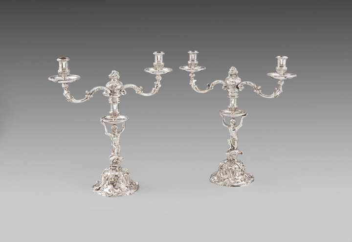 Pair of George II silver two-light candelabra